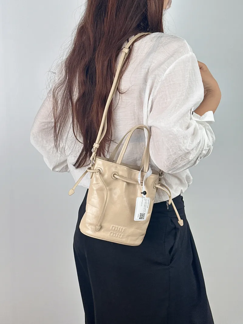 Miumiu Crossbody Bag Bucket Bag Taupe Calfskin 15.5 × 8.5 × 18 cm — on-model view 1 of 2