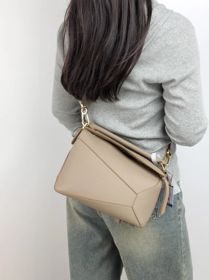 LOEWE Crossbody Bag Puzzle CC alfskin Small 24 × 10.5 × 16.5 cm — on-model view 2 of 3