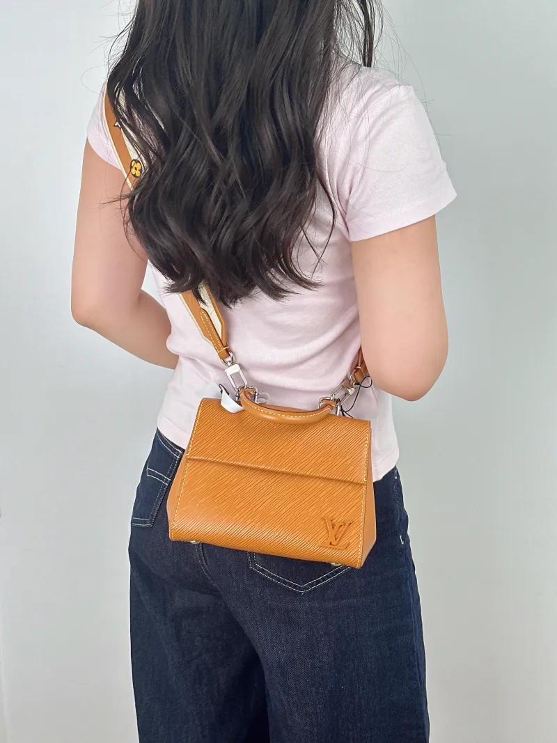 Louis Vuitton Crossbody Bag CLUNY Yellow Epi Embossed Calfskin Mini 20 × 7.5 × 16 cm Leather Tag — on-model view 1 of 2