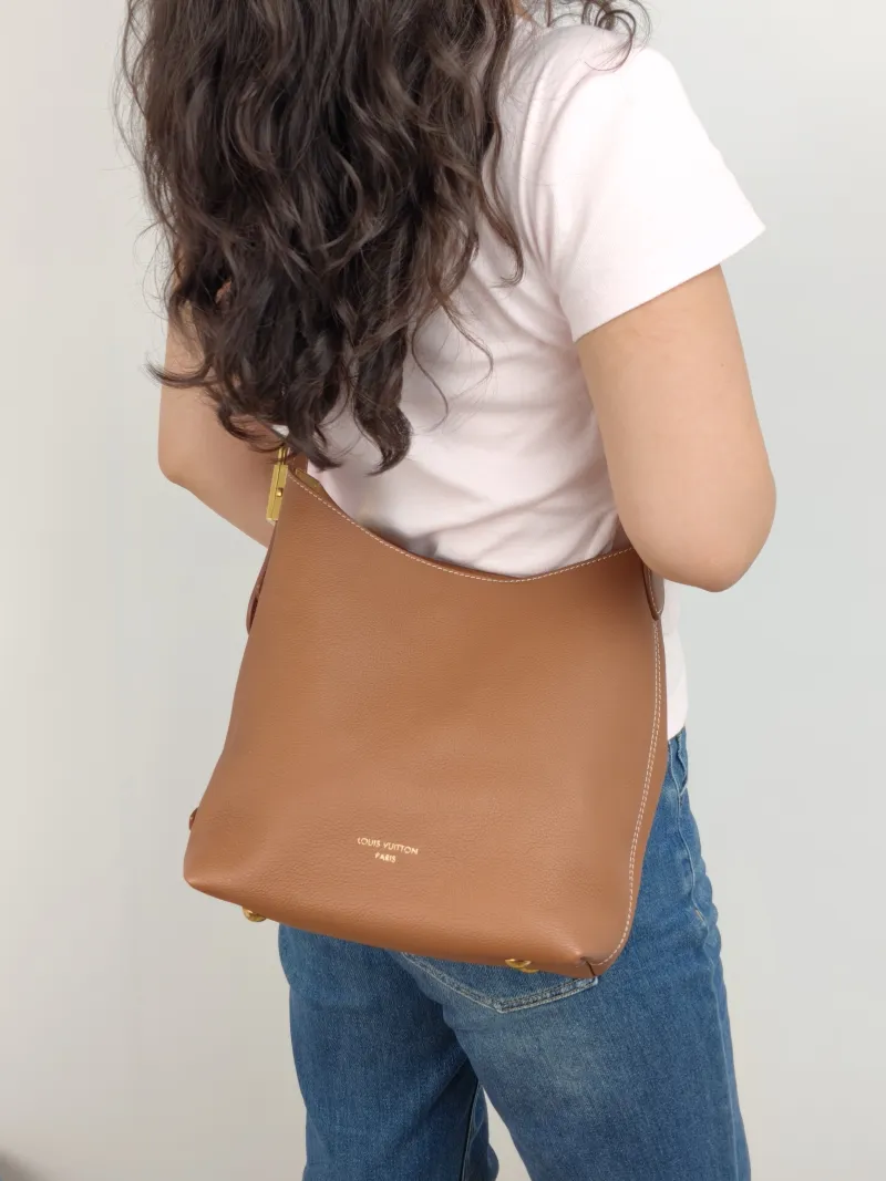 Louis Vuitton Shoulder Bag Low Key Hobo Shoulder Bag Calfskin Small 24 × 16 × 28 cm — on-model view 1 of 2