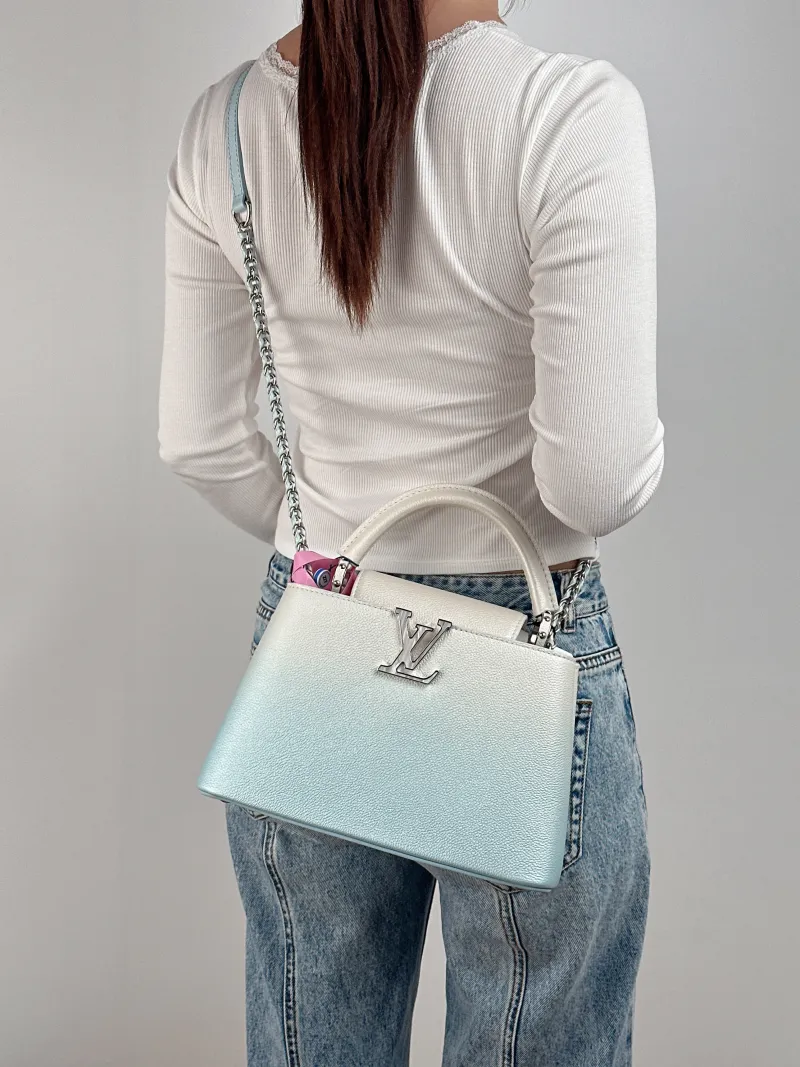 Louis Vuitton Top Handle Bag Capucines Calfskin BB 27 × 9 × 17.5 cm — on-model view 1 of 3