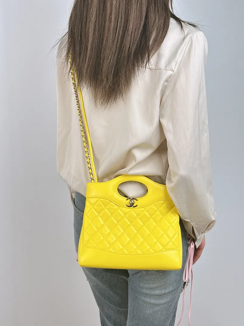 Chanel Crossbody Bag 31Bag Yellow Waxed Leather Mini 23 × 5.5 × 22 cm — on-model view 2 of 3
