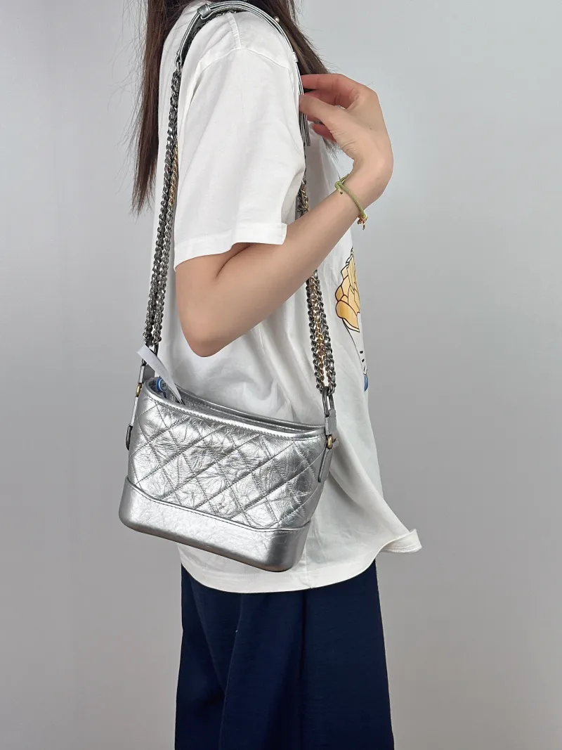 Chanel Crossbody Bag Gabrielle Gabrielle Bag Silver CC alfskin Small20 × 8 × 15 cm — on-model view 1 of 2