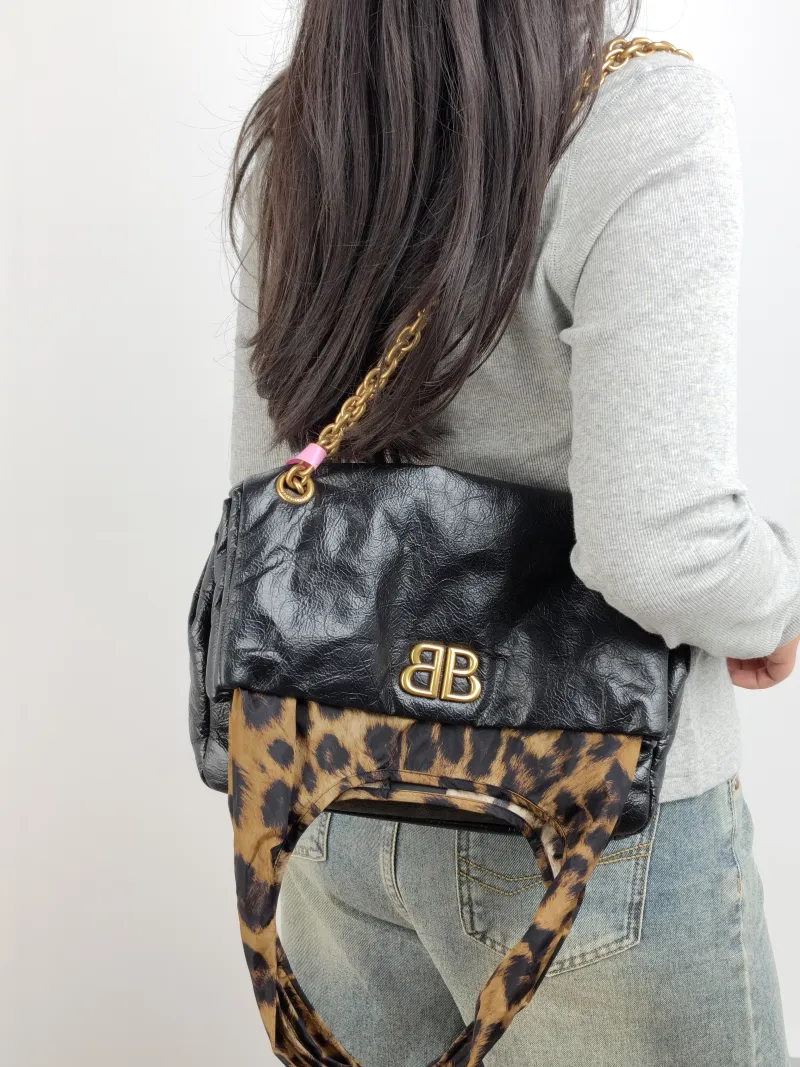 BALENCIAGA Shoulder Bag MONACO PLUS Black Calfskin Small 28 × 9 × 19 cm — on-model view 2 of 3
