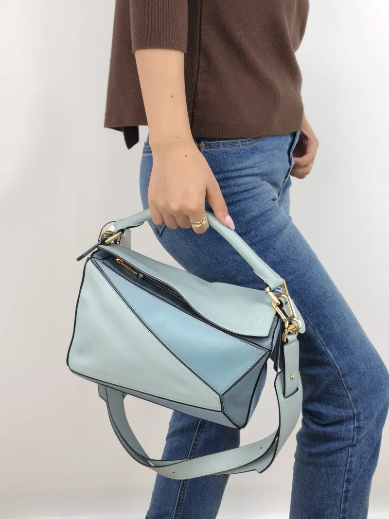 LOEWE Crossbody Bag Puzzle Blue CC alfskin Small 24 × 10.5 × 16.5 cm — on-model view 1 of 2