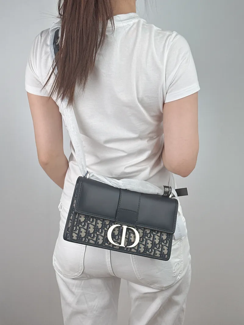 DIOR Crossbody Bag 30Montaigne 30 Blue Calfskin，Canvas Medium 25 × 9 × 16.5 cm — on-model view 1 of 2