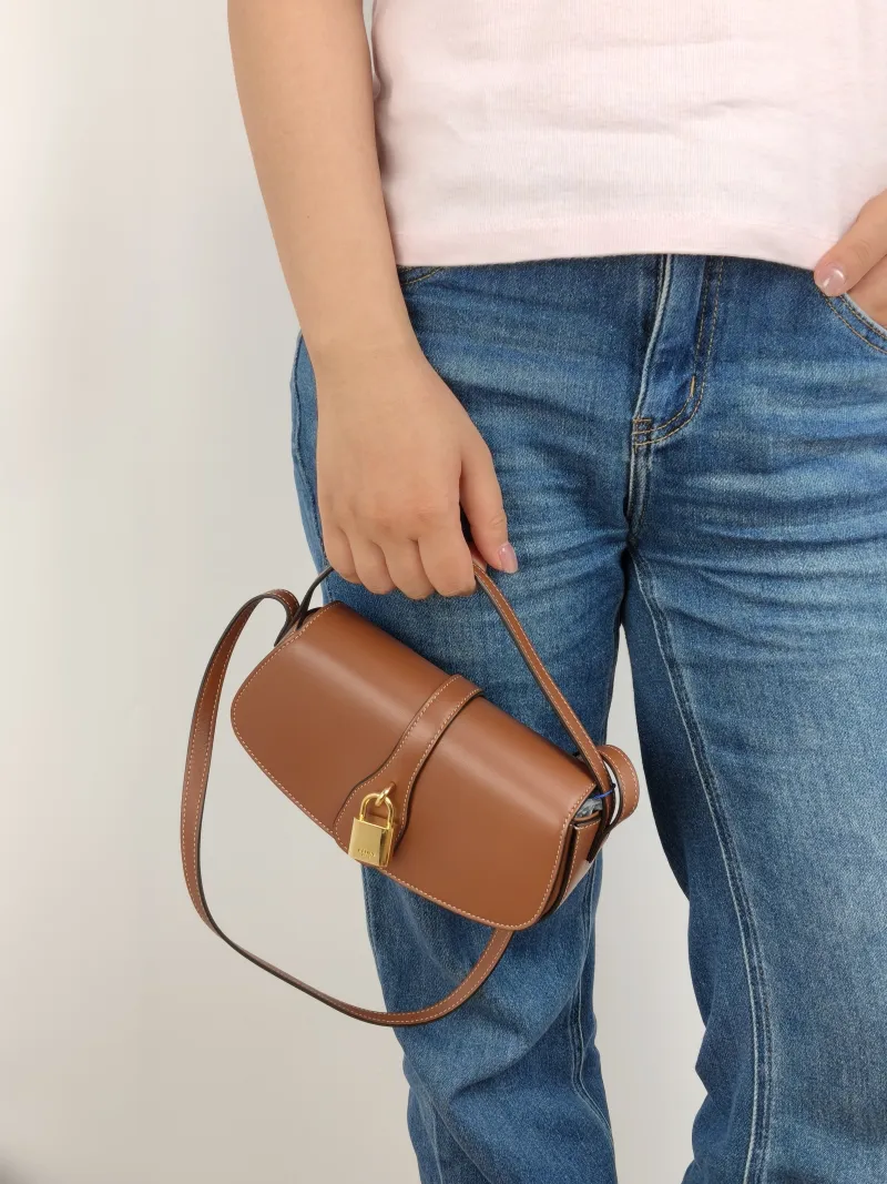 CELINE Crossbody Bag TABOU Brown Calfskin Mini 18 × 5 × 8 cm — on-model view 1 of 2