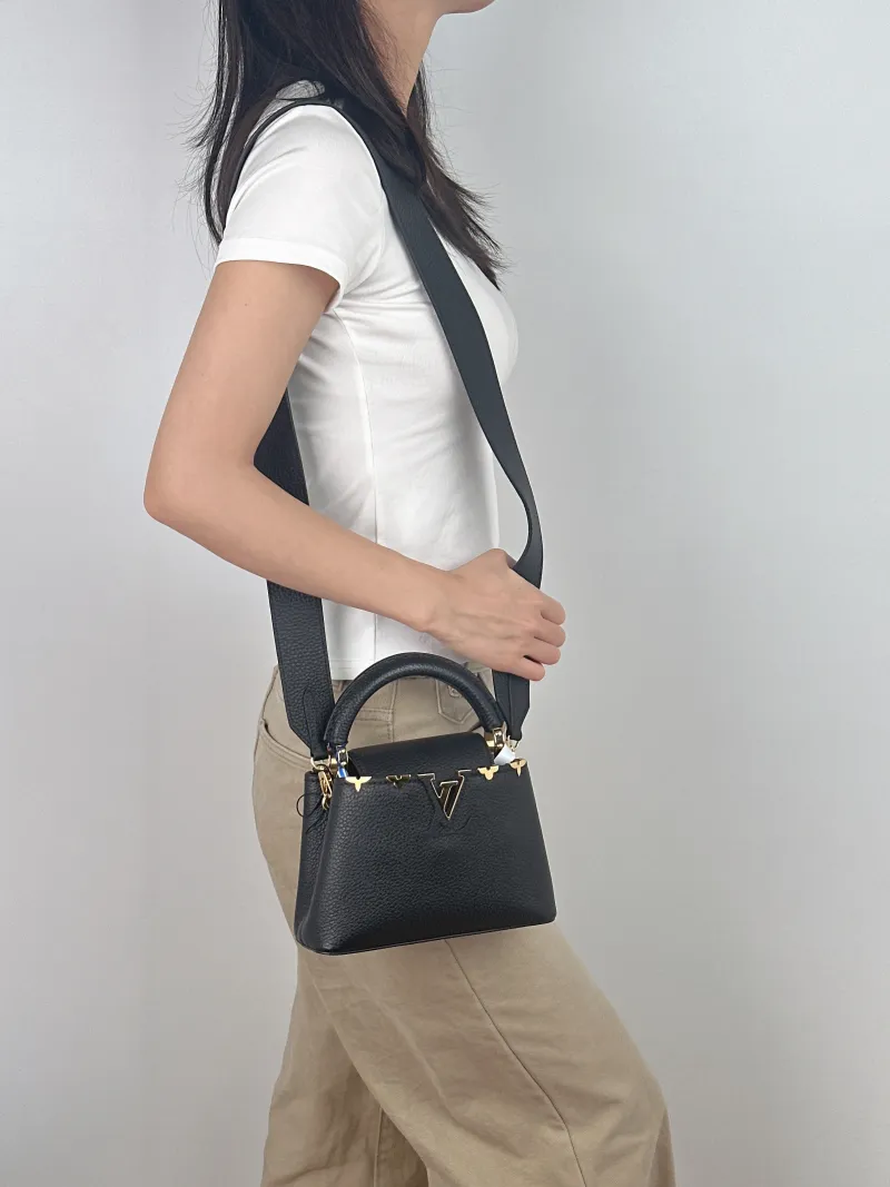 Louis Vuitton Crossbody Bag Capucines Black · Calfskin Mini 21 × 8 × 14 cm — on-model view 3 of 3