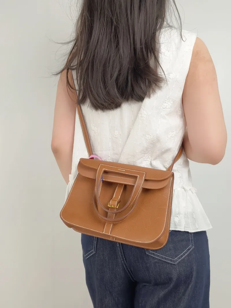 Hermès Shoulder Bag Halzan 25 Brown Saddle Leather Small25 × 8 × 17 cm — on-model view 3 of 3