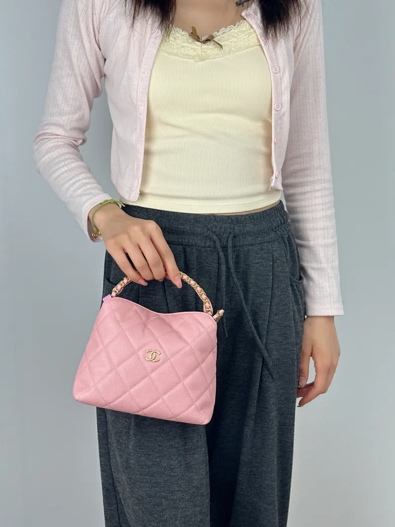 Chanel Crossbody Bag Woven Pink Grained Calfskin One Size18.5 × 7 × 14.5 cm — on-model view 1 of 2