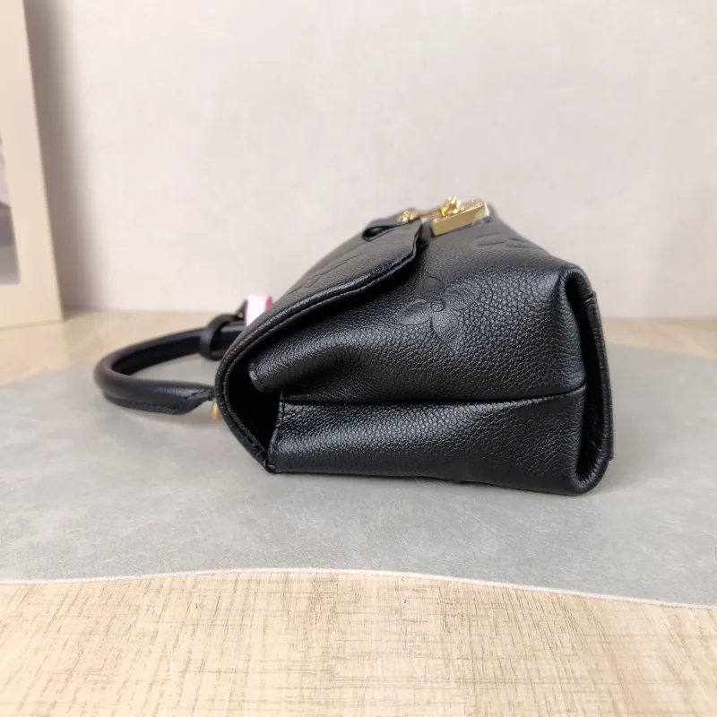 Louis Vuitton Crossbody Bag MADELEINE Black Monogram Empreinte Embossed Calfskin BB 24 × 8.5 × 17 cm — detail view 8 of 12
