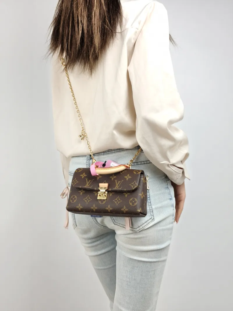 Louis Vuitton Crossbody Bag MADELEINE Monogram PVC nano 21 × 6 × 12.5 cm — on-model view 2 of 2