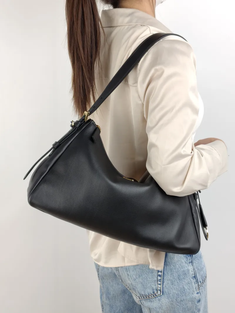 PRADA Shoulder Bag Aimée Black Calfskin One Size 38 × 11 × 22 cm — on-model view 1 of 2