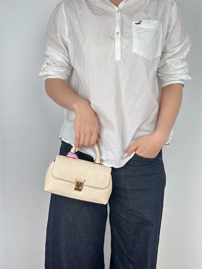 Louis Vuitton Crossbody Bag MADELEINE White Empreinte Embossed Calfskinnano21 × 6 × 12.5 cm — on-model view 3 of 3