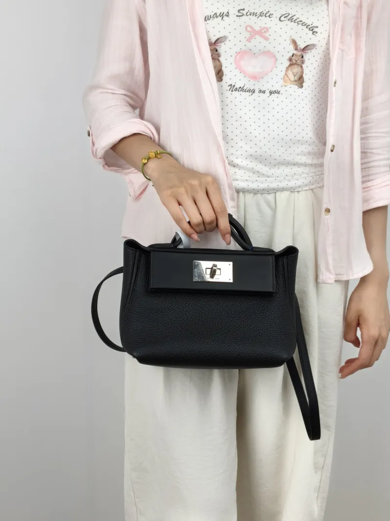 Hermès Crossbody Bag 24 · 24 21 Shoulder Bag Black Togo Calfskin · Swift Calfskin Mini 21 × 10 × 16 cm G — on-model view 2 of 3