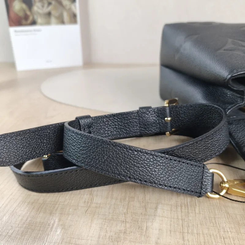 Louis Vuitton Crossbody Bag MADELEINE Black Monogram Empreinte Embossed Calfskin Medium 30 × 11 × 19.5 cm — detail view 9 of 12