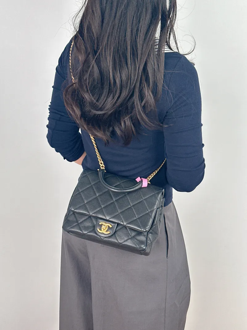Chanel Crossbody Bag Black with Gold-Tone Hardware Grained Calfskin One Size 22 × 8 × 18 cm — on-model view 1 of 2