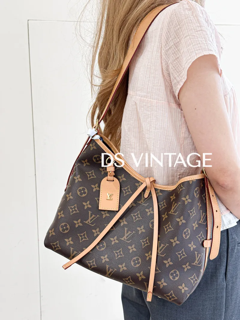 Louis Vuitton Crossbody Bag Carryall Monogram PVC Small29 × 12 × 24 cm — on-model view 1 of 3