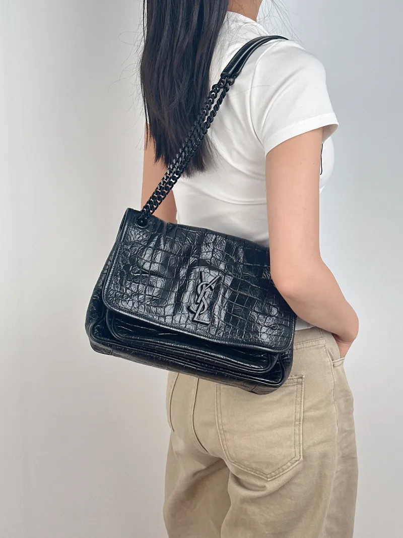 SAINT LAURENT Crossbody Bag Niki Black Waxed Leather Calfskin Medium 28 × 8.5 × 20 cm — on-model view 2 of 2