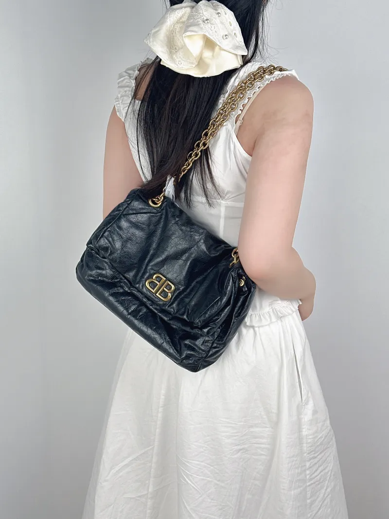 BALENCIAGA Shoulder Bag MONACO Chain Bag Black Calfskin Small28 × 10 × 18 cm — on-model view 1 of 2