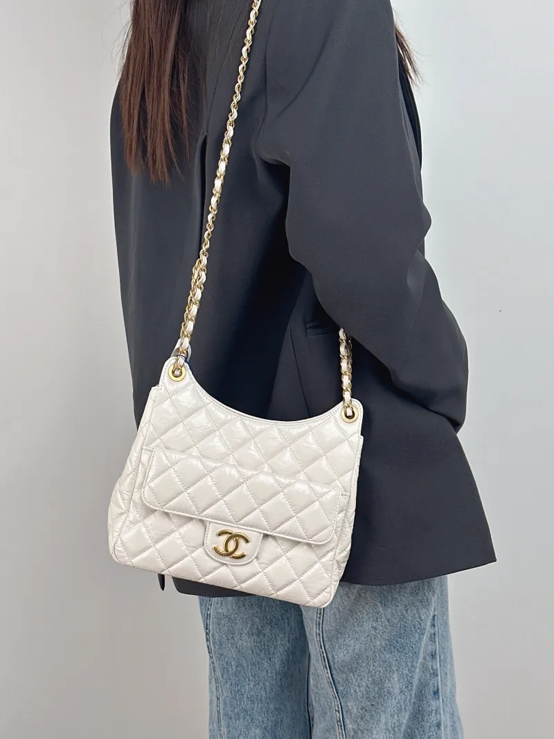 Chanel Crossbody Bag HOBO White Waxed Leather Medium 23 × 8 × 21 cm — on-model view 1 of 2