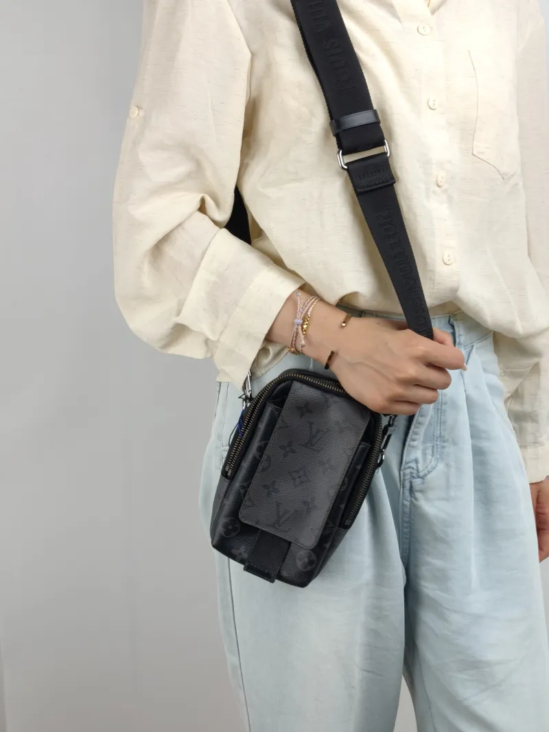 Louis Vuitton Crossbody Bag Double Phone Pouch Black Monogram PVC One Size 11 × 5 × 18 cm — on-model view 2 of 2