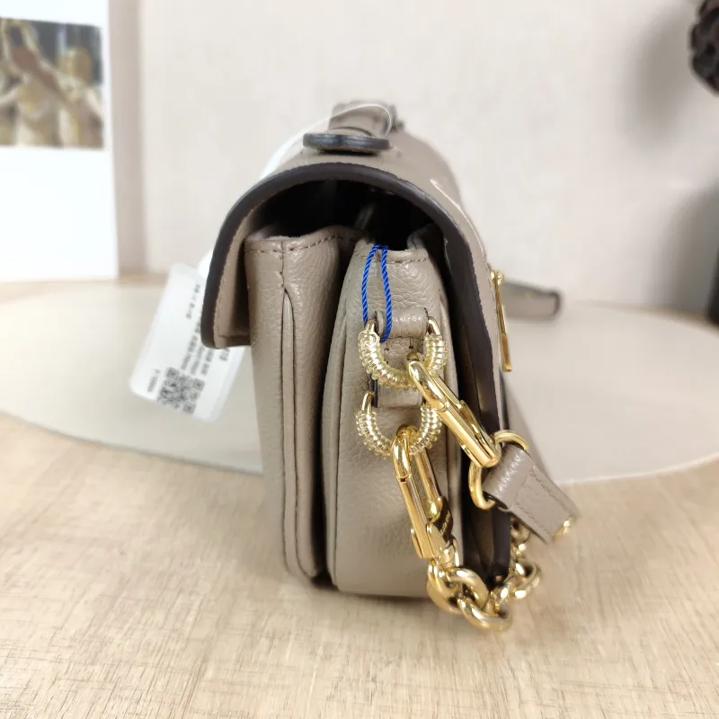 Louis Vuitton Crossbody Bag Pochette Métis East West Monogram Empreinte Embossed Calfskin Small 21.5 × 6 × 13.5 cm — detail view 8 of 12