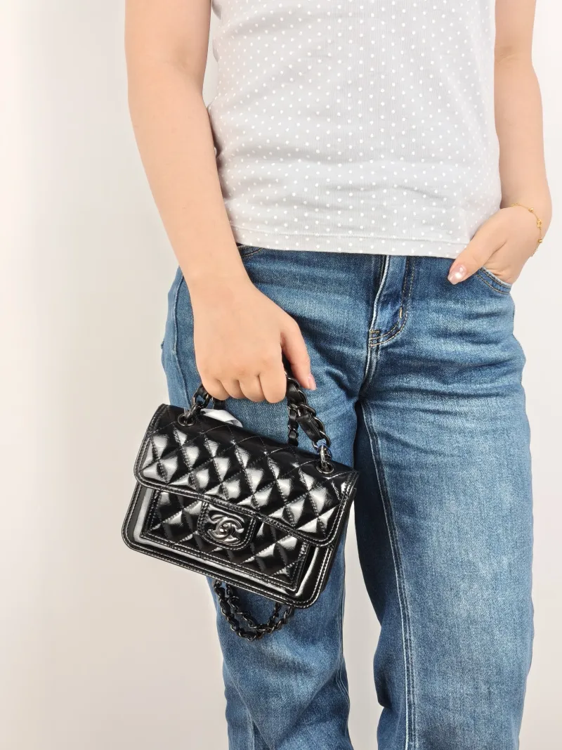 Chanel Crossbody Bag 23s Messenger Bag Black Waxed Leather Mini 19.5 × 6 × 13 cm — on-model view 1 of 3