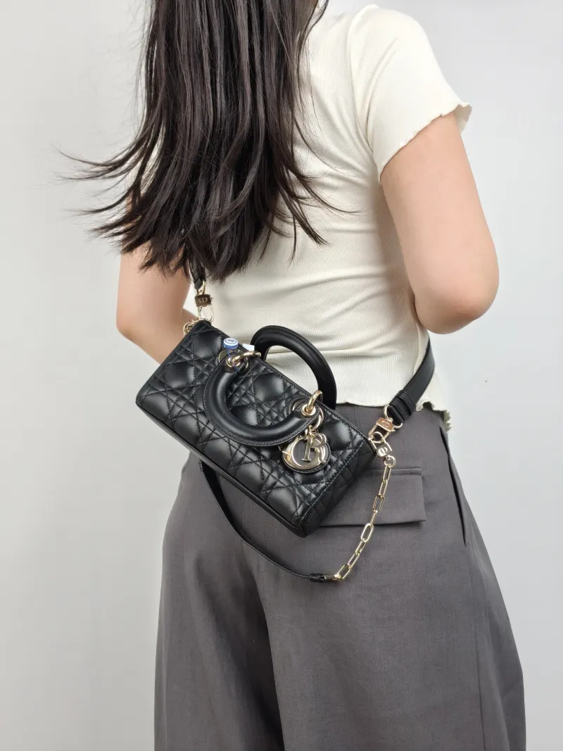 DIOR Top Handle Bag Lady D-Joy Black Lambskin Small 22 × 6 × 11 cm — on-model view 1 of 3