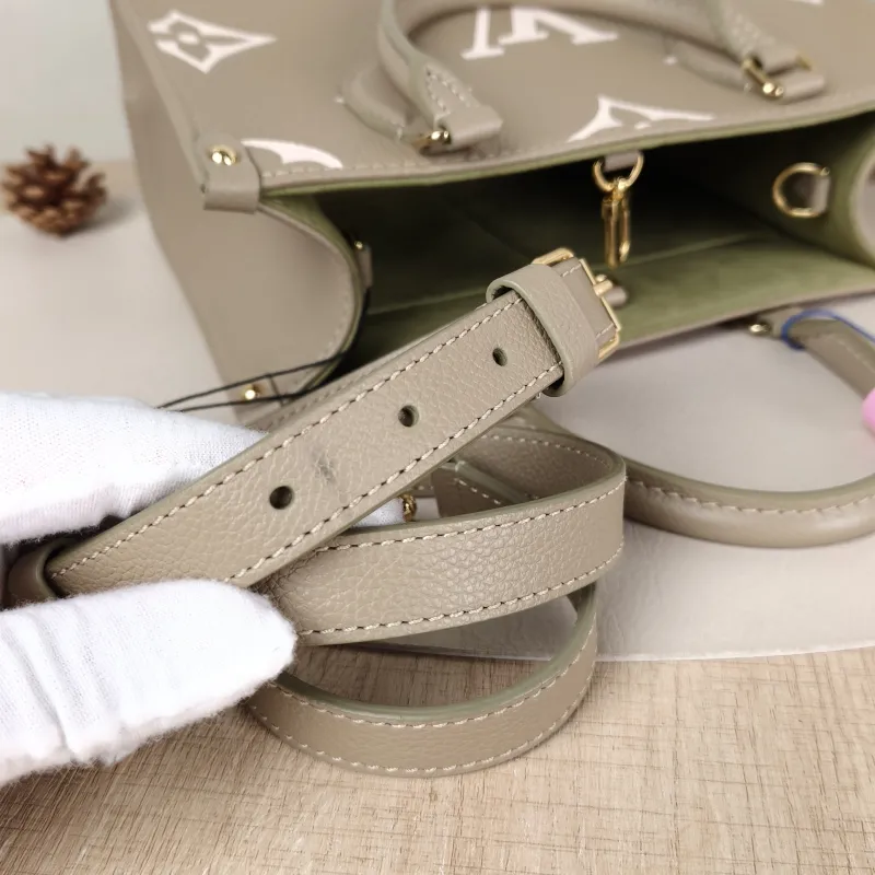 Louis Vuitton Top Handle Bag Onthego Monogram Empreinte Embossed Calfskin Small 25 × 11.5 × 19 cm — detail view 4 of 10