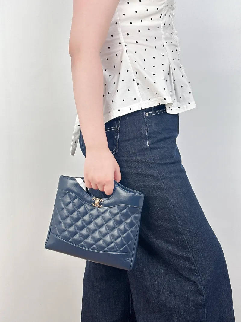 Chanel Crossbody Bag31Bag Navy Waxed Leathermini23 × 5.5 × 22 cm — on-model view 2 of 3