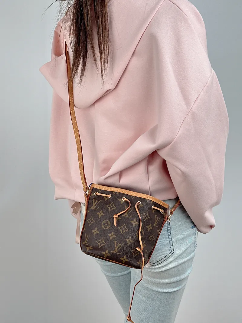 Louis Vuitton Crossbody Bag NANO NOÉ Bucket Bag Nano Monogram PVC nano 13 × 10 × 16 cm — on-model view 1 of 2