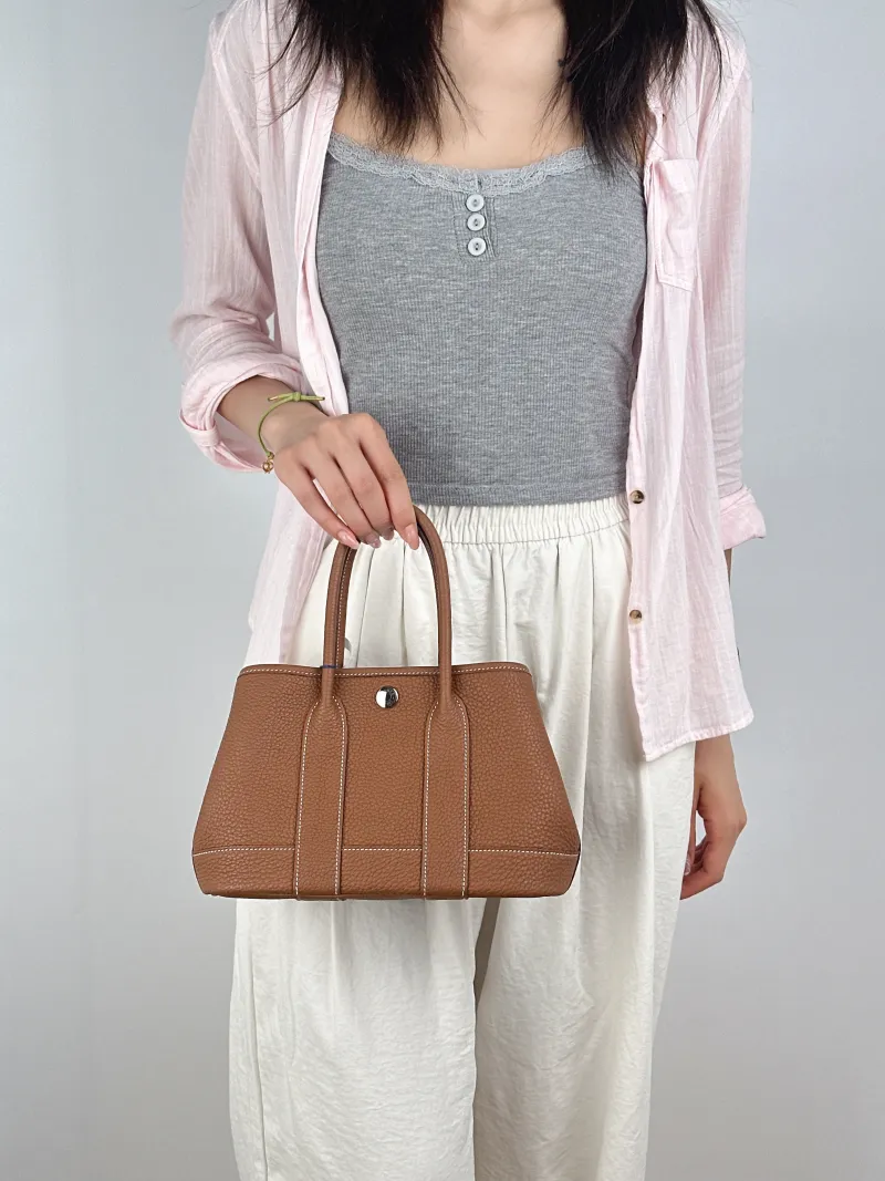 Hermès Top Handle Bag Neo Garden 23 Mini37 Brown Negonda Calfskinmini23 × 10 × 16 cm — on-model view 2 of 2