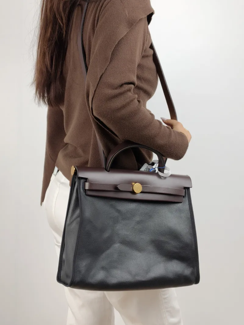 Hermès Crossbody Bag Herbag 31 Black Canvas Calfskin Medium 30.5 × 11 × 25.5 cm Z — on-model view 1 of 2