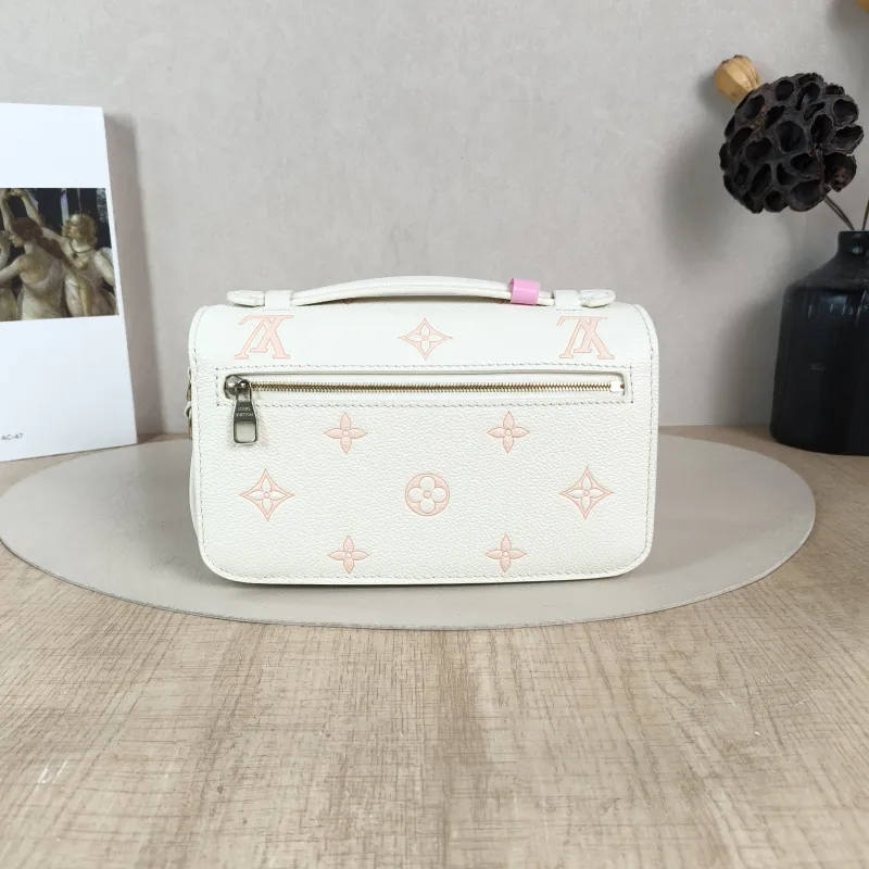 Louis Vuitton Crossbody Bag Pochette Métis East West White · Pink Monogram Empreinte Embossed Calfskin Small 21.5 × 6 × 13.5 cm — cover view 4 of 5