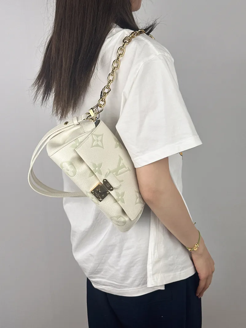 Louis Vuitton Crossbody Bag Favorite White · Green Empreinte Embossed Calfskin Monogram Medium24 × 9 × 14 cm — on-model view 2 of 2