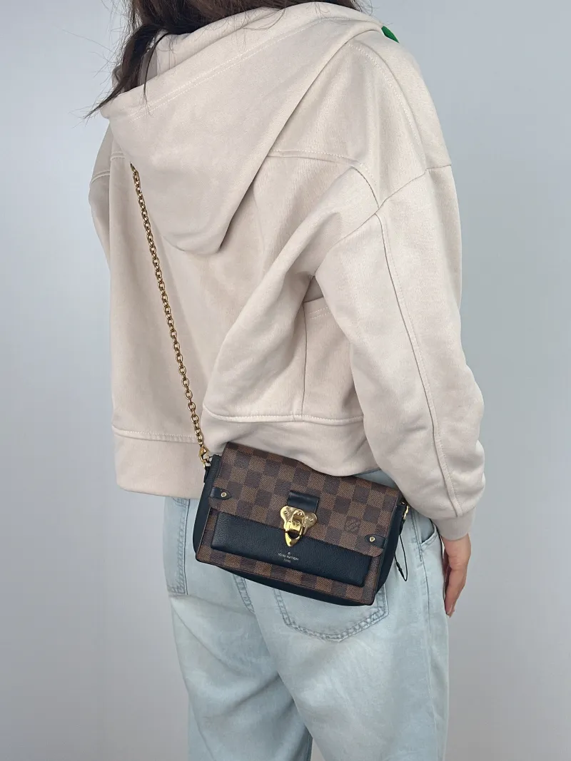 Louis Vuitton Crossbody Bag VAVIN woc Brown PVC Mini 19 × 4 × 12.5 cm — on-model view 1 of 2