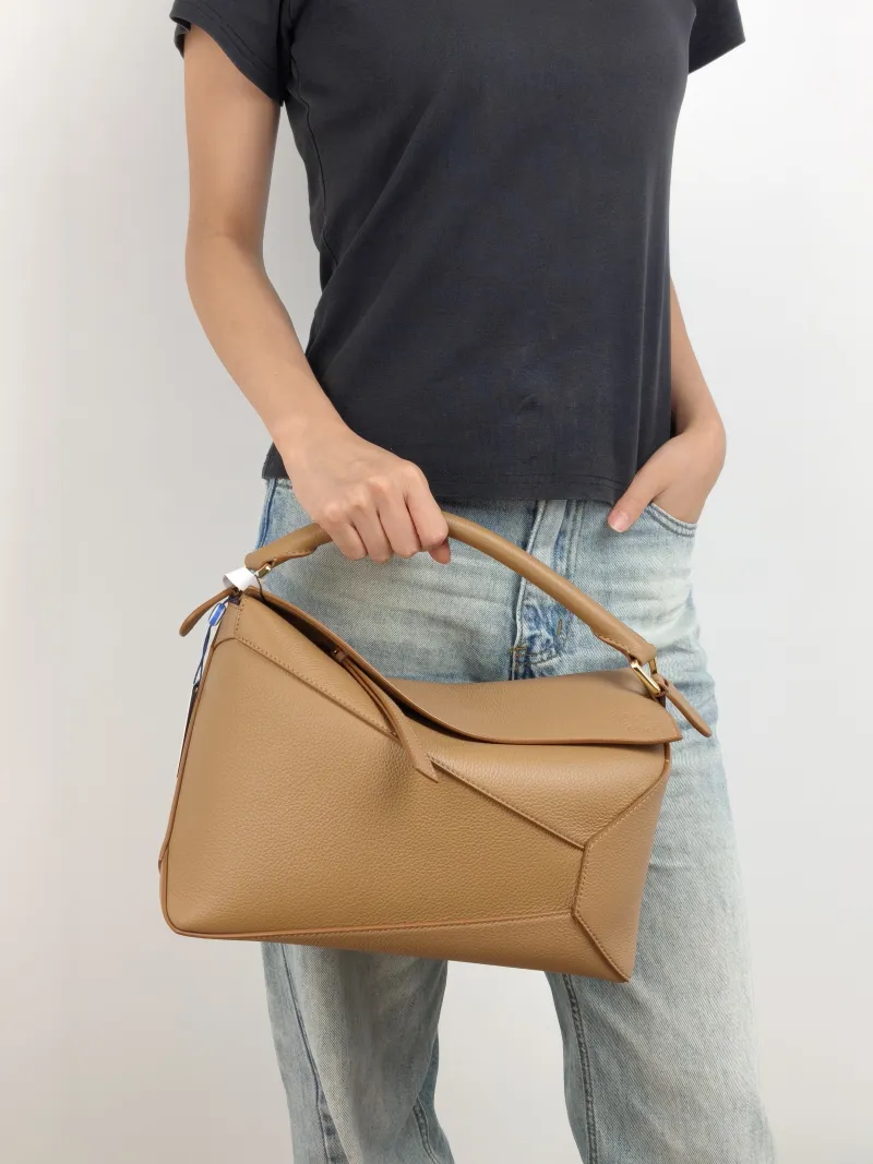 LOEWE Shoulder Bag Puzzle Brown CC alfskin Medium 29 × 14 × 19.5 cm — on-model view 1 of 3