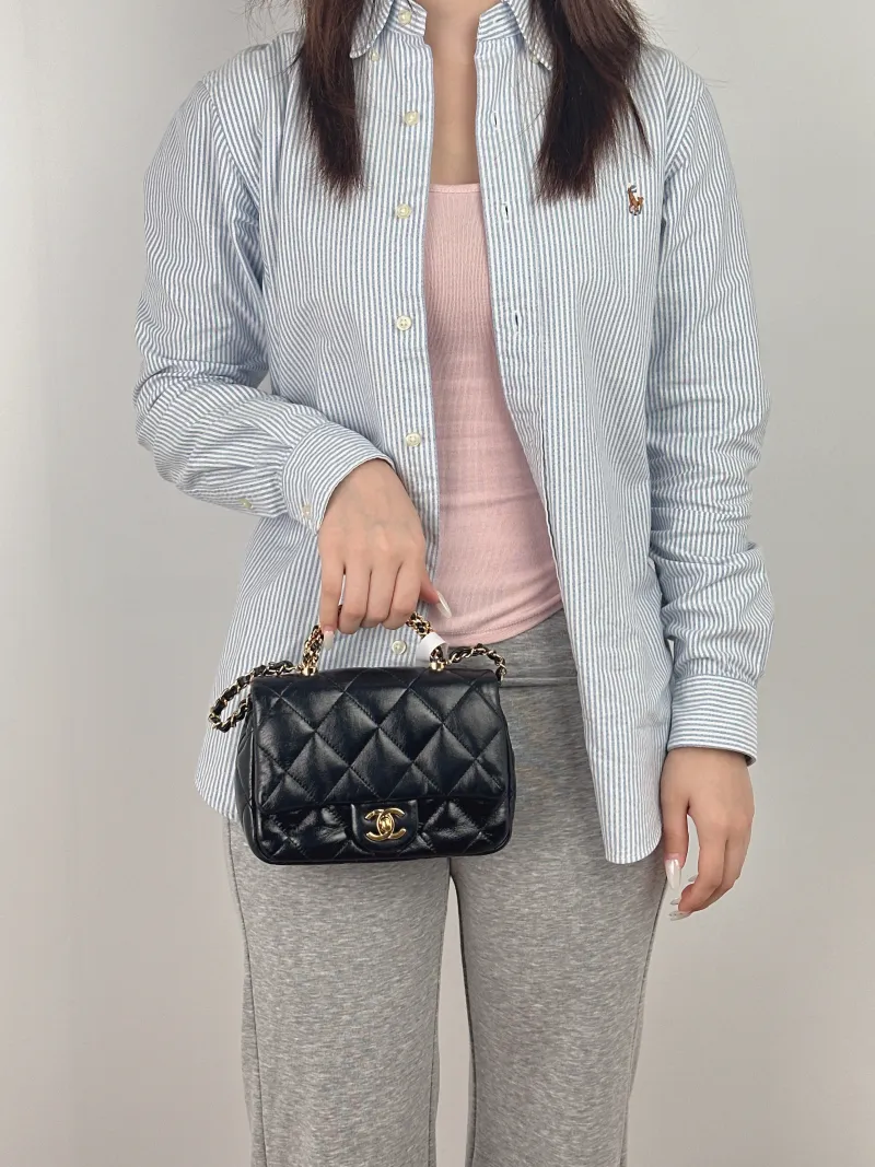 Chanel Crossbody Bag 24b Black Lambskin Mini 19 × 8.5 × 14 cm — on-model view 3 of 3