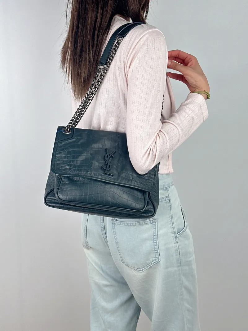 SAINT LAURENT Crossbody Bag Niki D Green Waxed Leather Medium 28 × 8.5 × 20 cm — on-model view 1 of 2