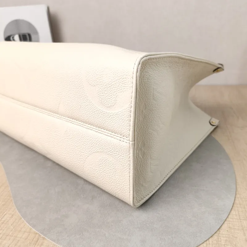 Louis Vuitton Shoulder Bag Onthego Medium White Monogram Empreinte Embossed Calfskin Medium 35 × 14 × 27 cm — detail view 2 of 12