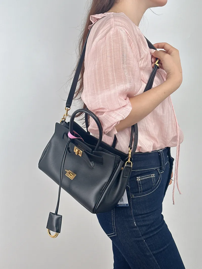 BALENCIAGA Crossbody Bag Bel air Black Calfskin Mini 23.5 × 8 × 17 cm — on-model view 1 of 2