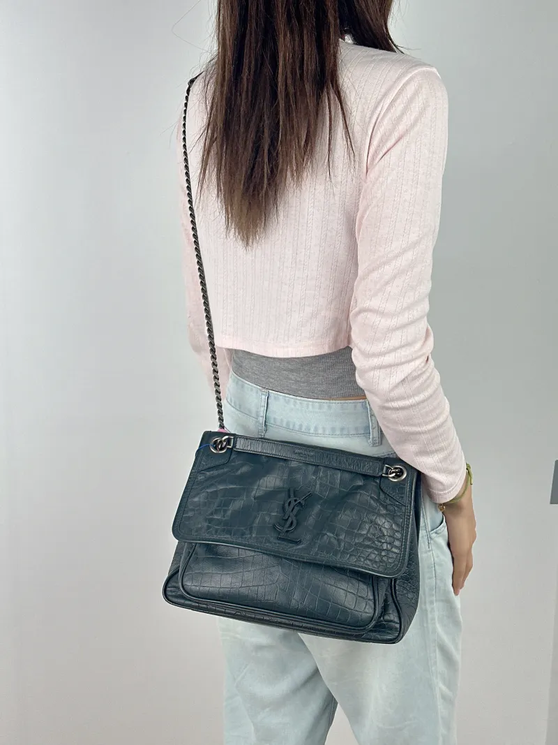 SAINT LAURENT Crossbody Bag Niki D Green Waxed Leather Medium 28 × 8.5 × 20 cm — on-model view 2 of 2