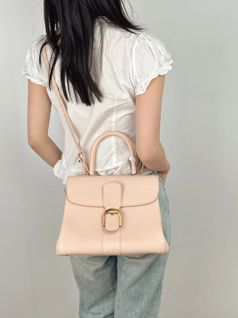 DELVAUX Top Handle Bag Brillant Pink Calfskin Medium29 × 15 × 22 cm — on-model view 2 of 3