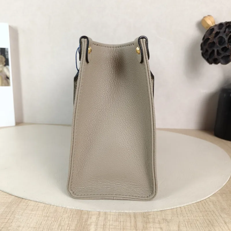 Louis Vuitton Shoulder Bag Onthego · White Monogram Empreinte Embossed Calfskin Small 25 × 11.5 × 19 cm — detail view 5 of 10