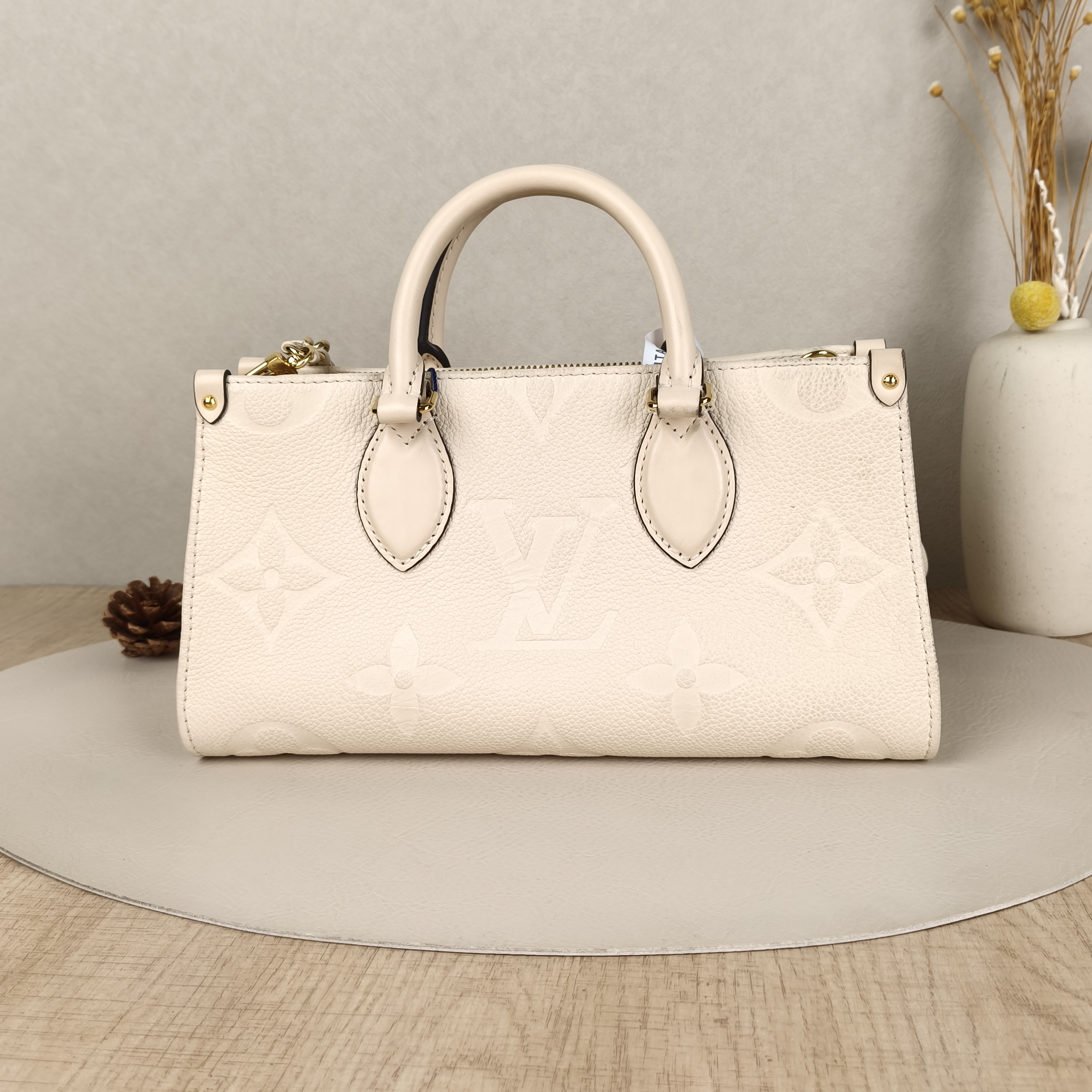 Louis Vuitton Crossbody Bag Onthego East West Two Straps White Monogram Empreinte Embossed Calfskin Small25 × 10 × 13 cm