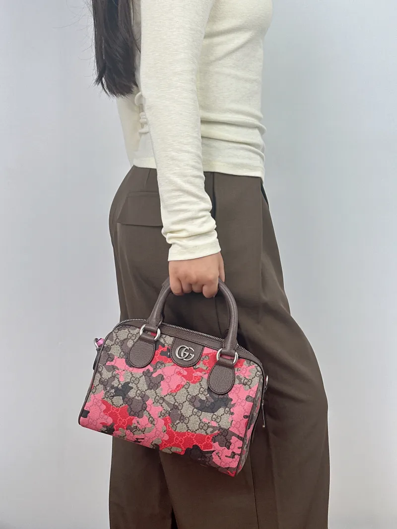 GUCCI Top Handle Bag Top Handle Bag Pink Monogram PVC Small 25 × 14 × 16 cm — on-model view 1 of 2