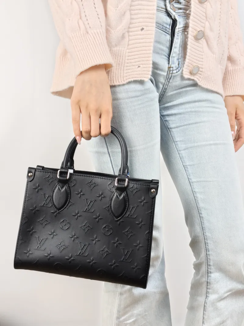 Louis Vuitton Shoulder Bag Onthego Black Calfskin Small 25 × 11.5 × 19 cm Shoulder Strap — on-model view 1 of 2