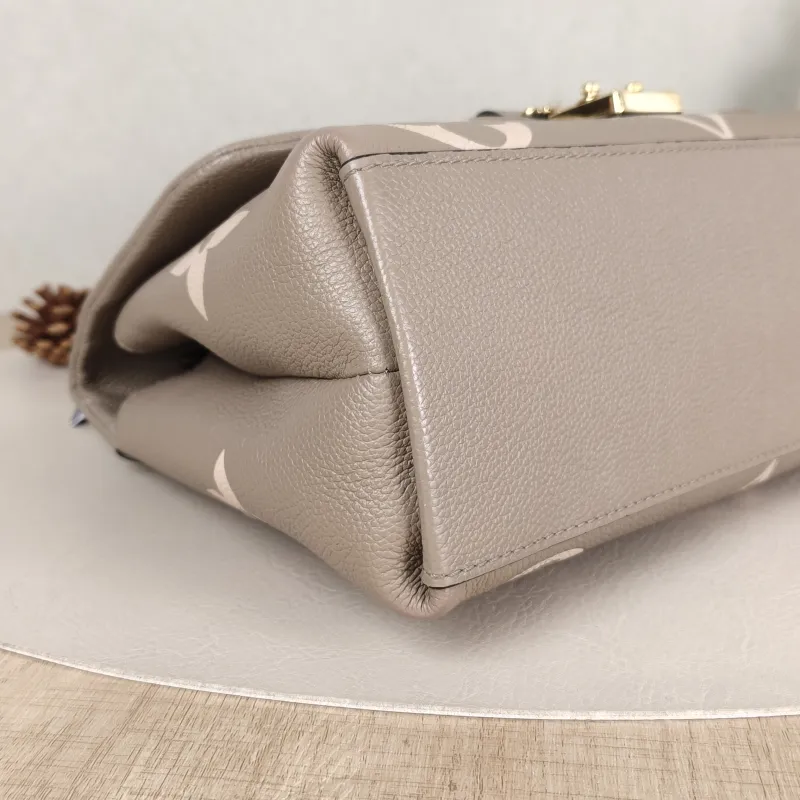Louis Vuitton Crossbody Bag MADELEINE Empreinte Embossed Calfskin Medium30 × 11 × 19.5 cm — detail view 2 of 14