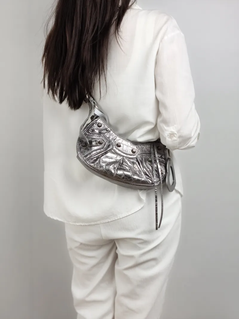 BALENCIAGA Crossbody Bag LE CAGOLE Silver Calfskin XS 26 × 7 × 16 cm — on-model view 1 of 2